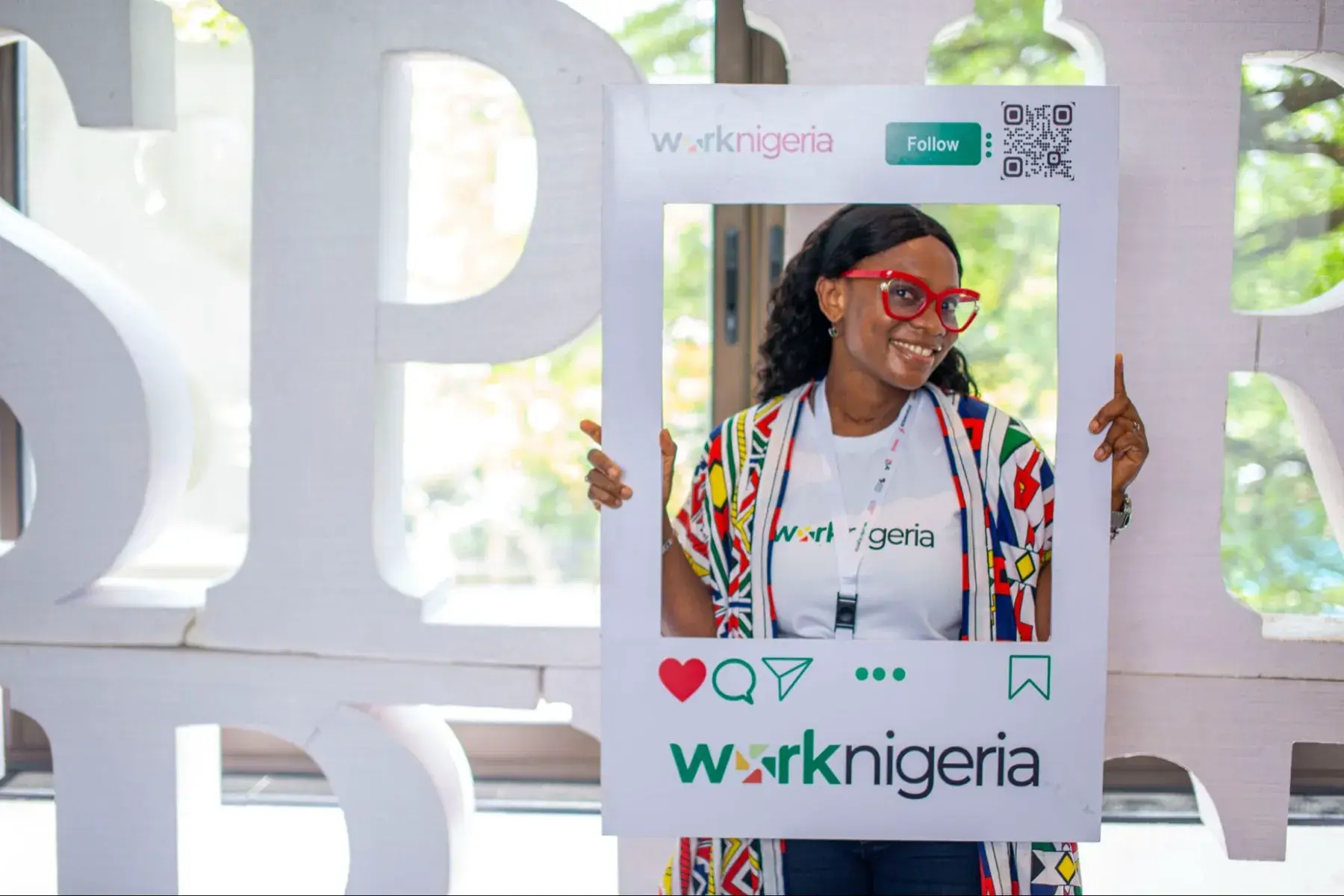A WorkNigeria ambassador holding the WorkNigeria frame