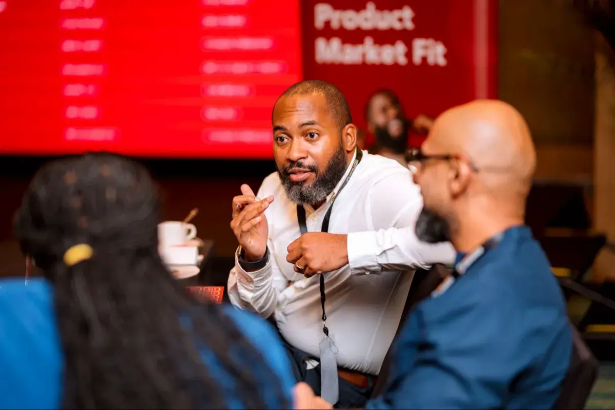 A speaker presenting on customer discovery